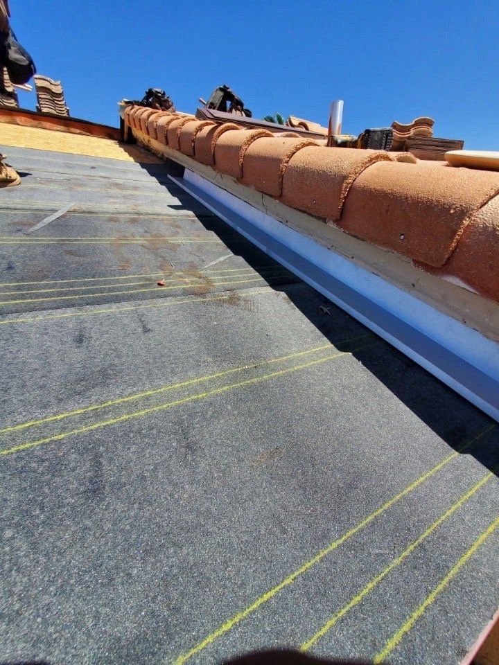 New underlayment and staged ridge tiles on a tile re-roof